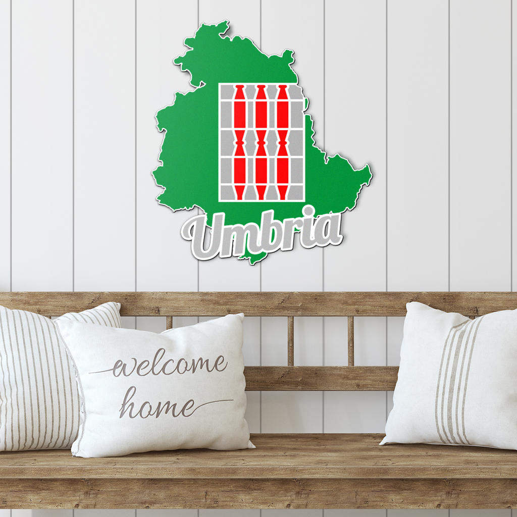 Umbria Map - Colored Metal Art displayed on a wooden bench with pillows, showcasing its intricate design and suitability for enhancing indoor or outdoor spaces.
