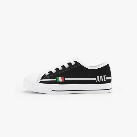 Kid’s Low-Top Shoes Juve featuring a black and white design with a side flag, canvas upper, rubber outsole, and lace-up closure.