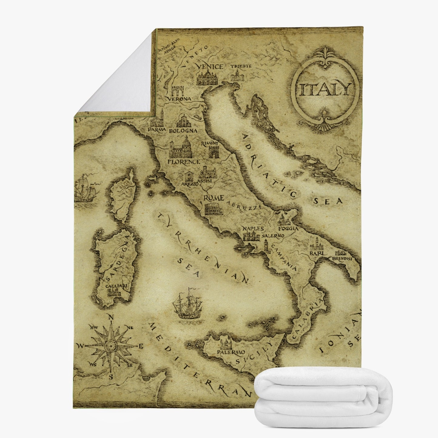 Italy Vintage Map Fleece Blanket featuring a detailed map of Italy, folded alongside a stack of white towels, showcasing premium suede polyester fabric.